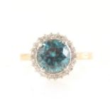 A heat treated blue zircon and diamond cluster ring.