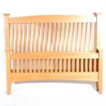 A Contemporary oak double bedstead,