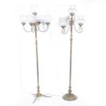 Two candelabra style floor lamps, with glass shades and a selection of spare shades.