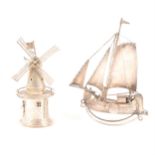 A late 19th century Dutch .833 standard miniature sailing boat, and novelty windmill