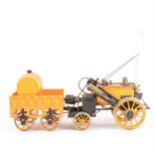 Hornby 3 1/2inch gauge live steam Stephenson Rock locomotive with wagon, 42cm total length, unboxed.