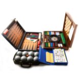 A modern Mahjong set, roulette wheel, backgammon and pentaque set