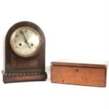 An oak cased mantel clock and a stained wood slide box