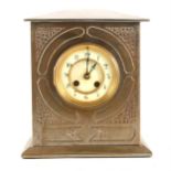 A steel plated mantel clock