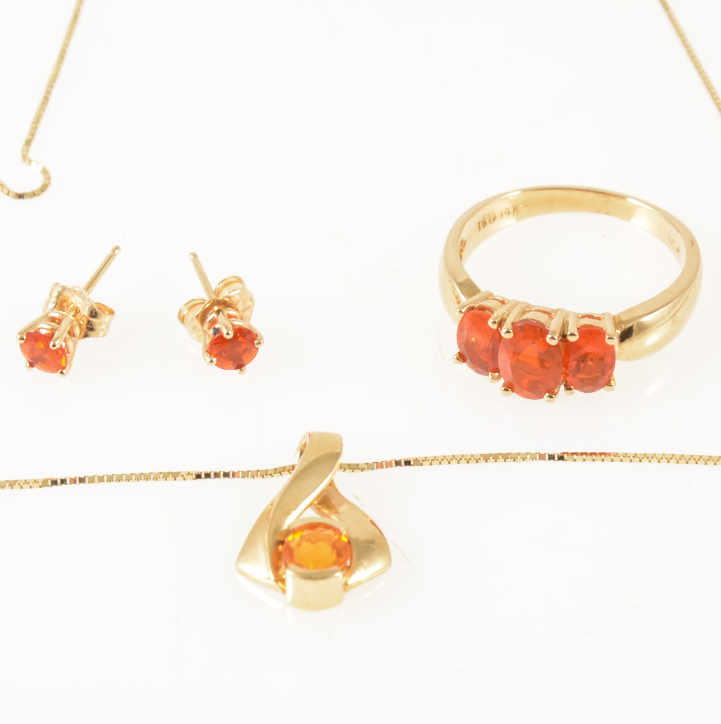 A suite of Mexican fire opal jewellery, ring, pendant and pair of earstuds.