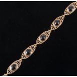 A 9 carat rose gold garnet set bracelet.