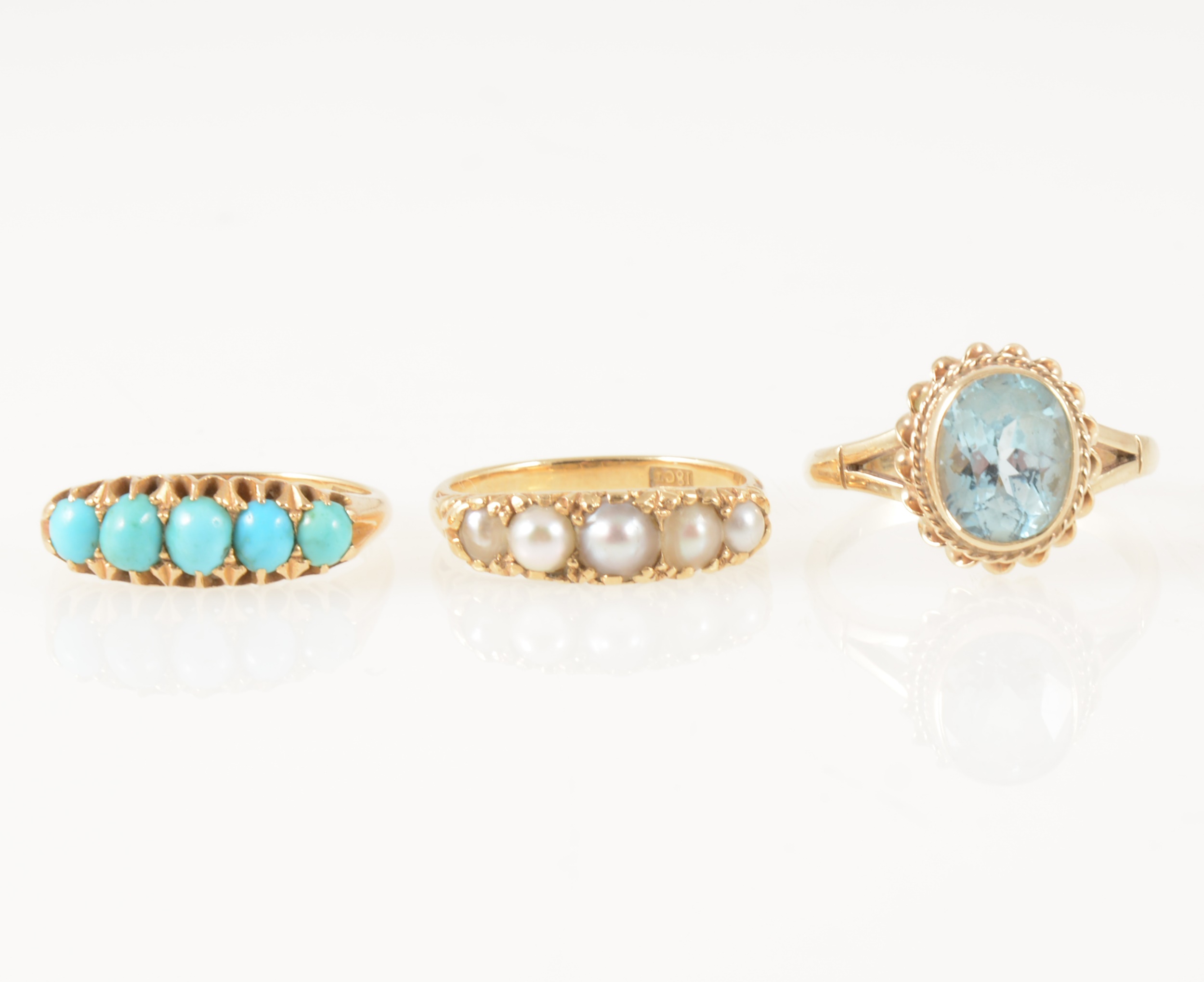 Three gemset dress rings.