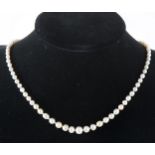 An untested mix colour pearl necklace with diamond clasp.