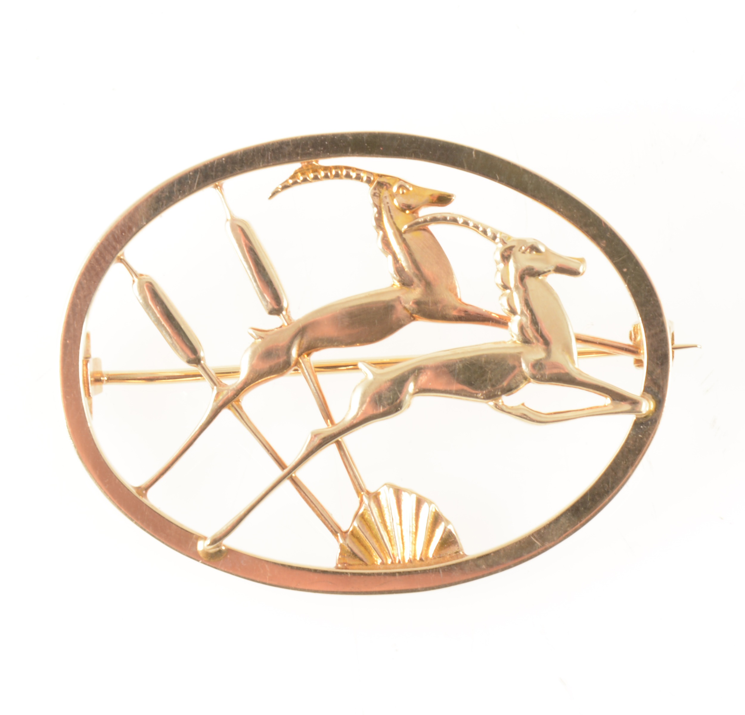 Geoffrey Bellamy for Ivan Tarratt a 9 carat yellow gold leaping gazelle brooch.