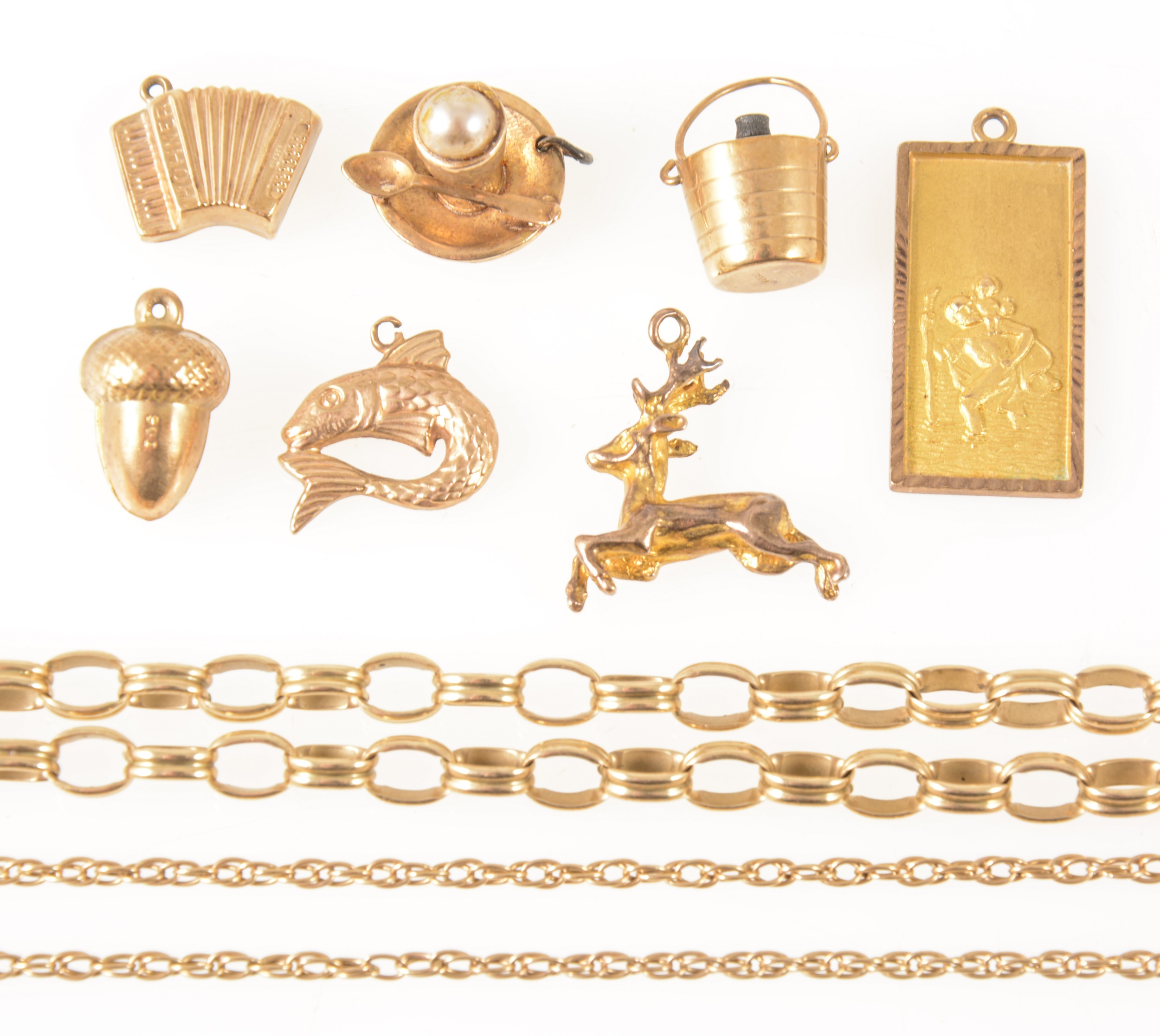 A 9 carat yellow gold bracelet and loose charms.