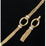 An 18 carat yellow gold and diamond bracelet with matching pendant,