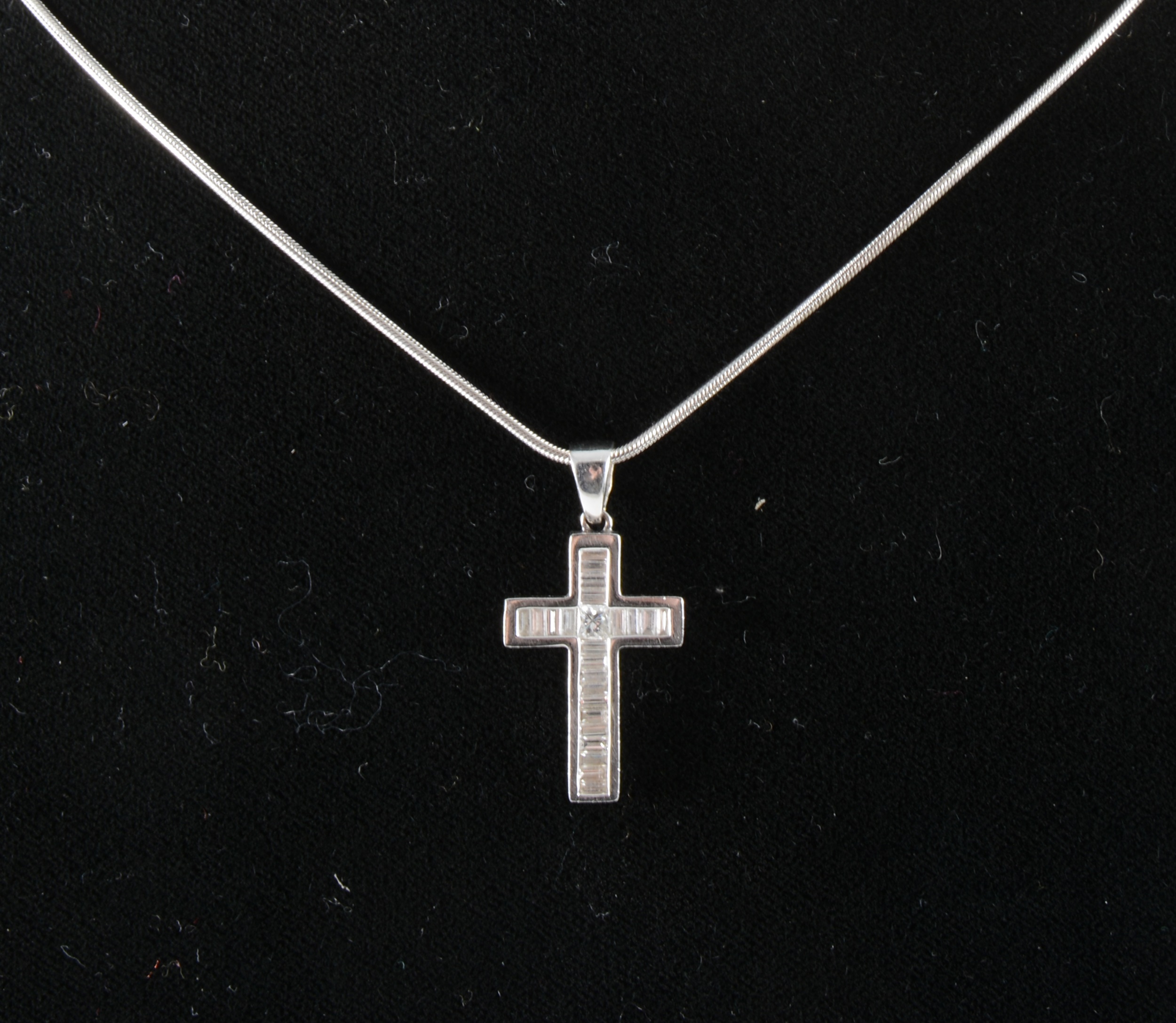 A diamond cross on chain.