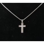A diamond cross on chain.