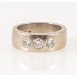 A lady's/gentleman's diamond three stone ring.