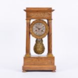 A Napoleon III rosewood and marquetry portico clock