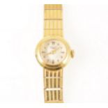 Longines - a lady's yellow metal bracelet watch.
