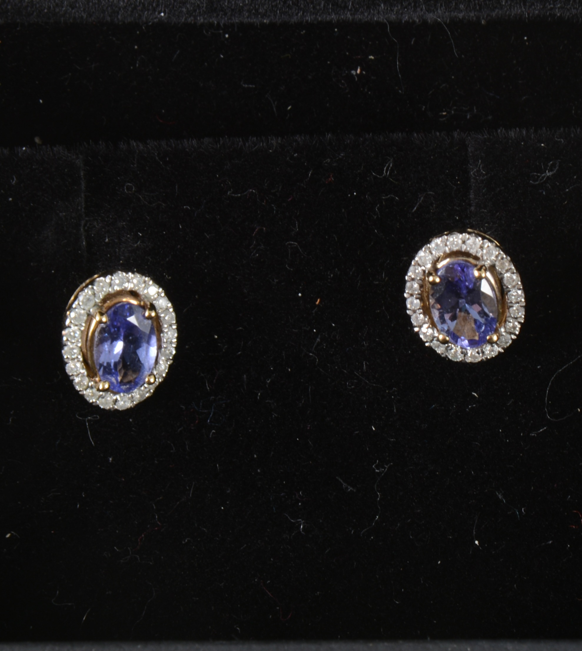 A pair of tanzanite and diamond earstuds.