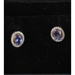 A pair of tanzanite and diamond earstuds.