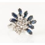 A modern sapphire and diamond cluster ring.