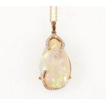 An opal and diamond pendant and chain