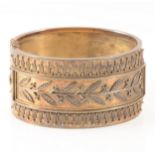 A mid 19th Century yellow metal 33mm wide half hinged bangle
