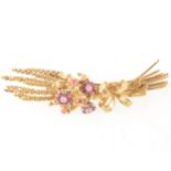 An 18 carat gold ruby and diamond brooch, in the form of sheaf of corn.