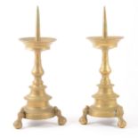 A pair of brass pricket candlesticks, probably 18th century