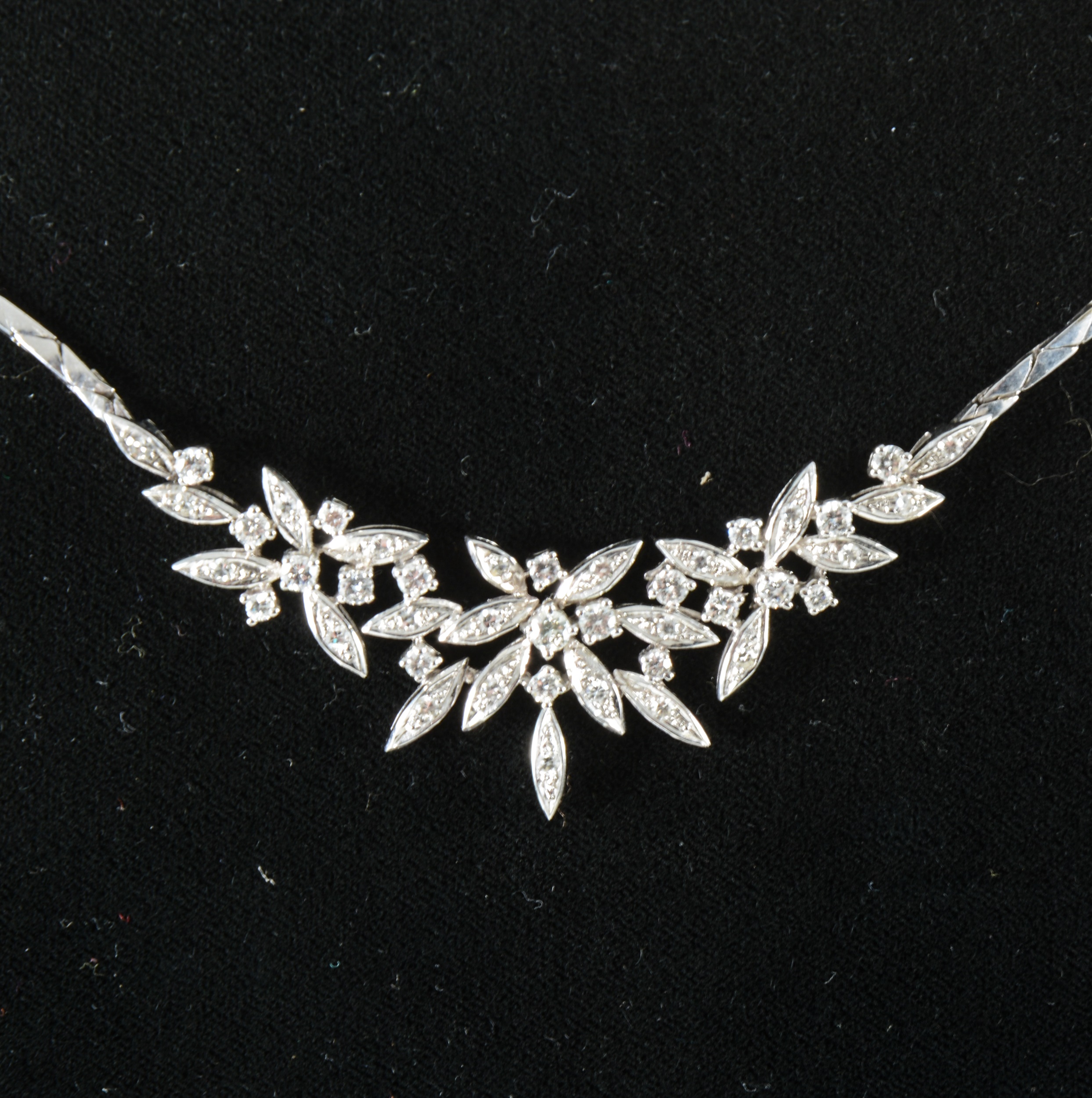 A diamond set necklace.