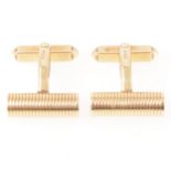 A pair of 9 carat yellow gold cylindrical cufflinks.