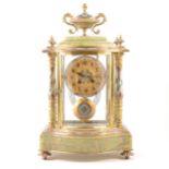 A French onyx, gilt metal and champleve enamel mantel clock, late 19th century