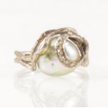 A pearl and diamond dress ring.