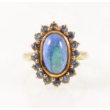 A black opal and sapphire dress ring.