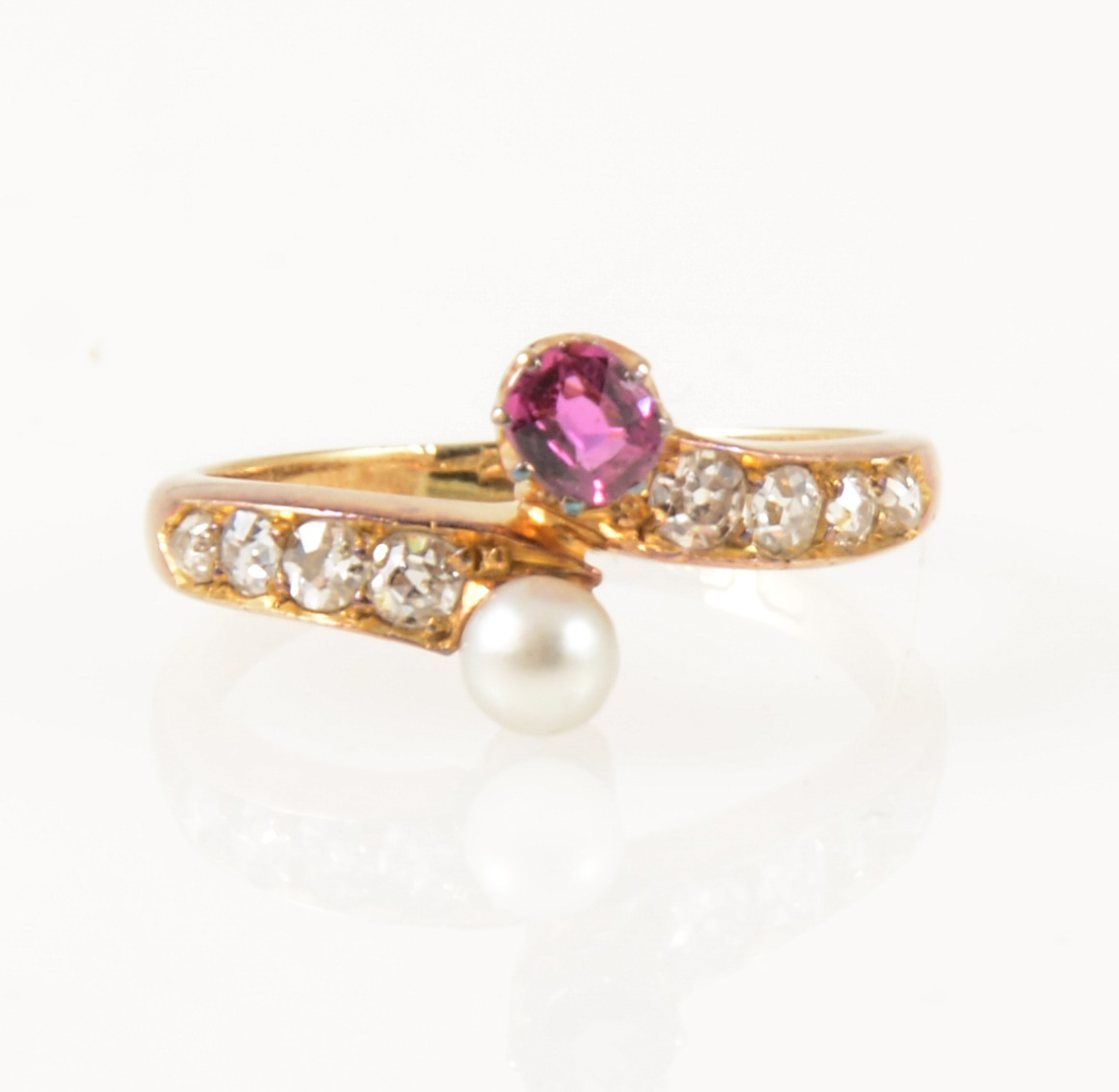 A pearl and diamond crossover ring.