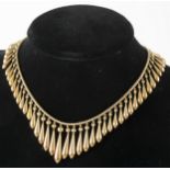 A late 19th Century yellow metal fringe necklace.