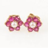 A pair of ruby and pearl cluster ear studs