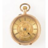 A small yellow metal open face pocket watch,