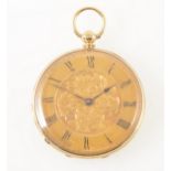 A small yellow metal open face pocket watch.