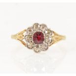 A ruby and diamond cluster ring.