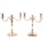 A pair of Georgian style silver three-light candelabra, Barker Ellis Silver Co, Birmingham, 1988