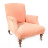 Edwardian peach upholstered armchair.
