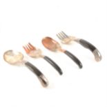 Two pairs of Eastern white and copper coloured metal and horn servers
