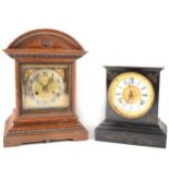 A German oak cased mantel clock, Jungens; and an American Ansonia mantel clock