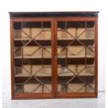 A mahogany bookcase top,
