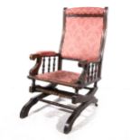 An American stained wood rocking chair