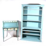 A modern suite of painted 'duck egg blue' bookshelves and similar cylinder front bureau.