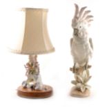 A Royal Dux model of a Cockatoo, and a Continental figural table lamp