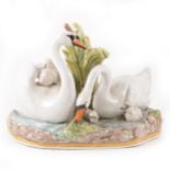 A large Meissen porcelain group of swans and cygnets on a pond