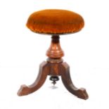 A Victorian walnut piano stool