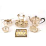 A silver teapot, two silver topped perfume bottles and box of plated wares.