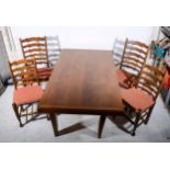 An oak dining table, and six beech wavy-back dining chairs.
